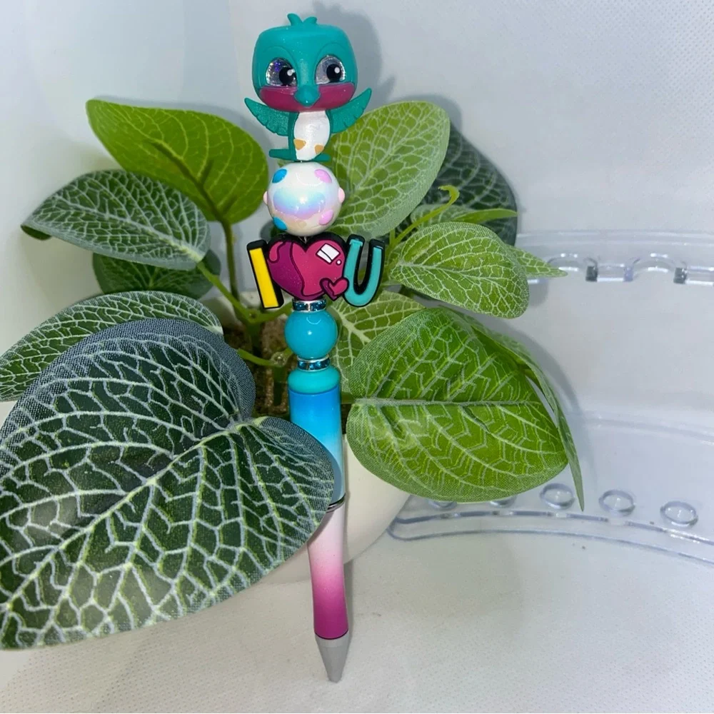 Blue and Green Bird Toy with Round Body and Large Eyes